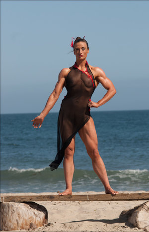 Beautiful teen Mango A removes sports bra and white socks to pose naked